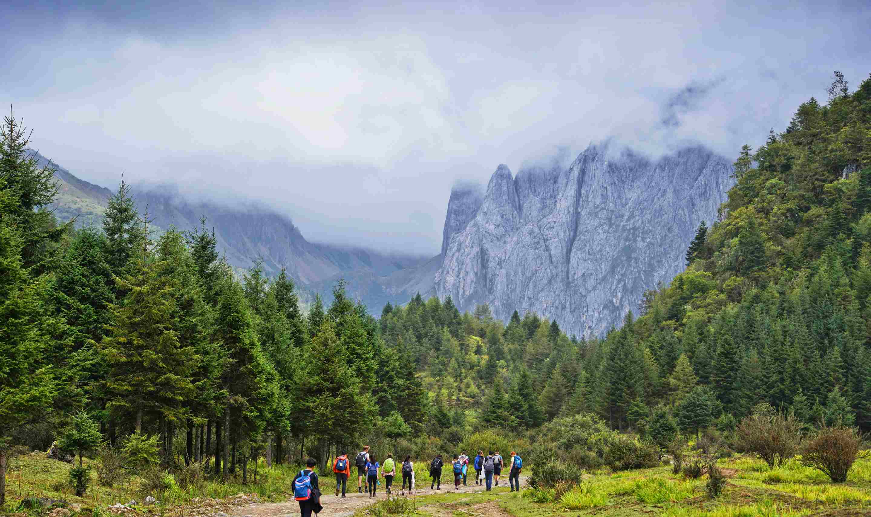 Hiking group with mountains
